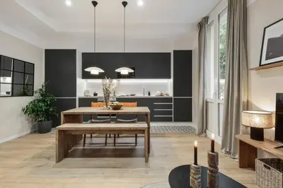 a living room with a table and a dining room at Sazos - 2 bedrooms in Sant Antoni in Barcelona