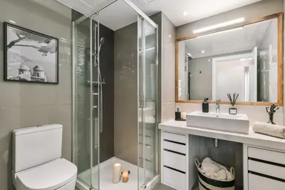 a kitchen with white cabinets and a sink at Minori - 2 bedrooms and pool in Poblenou in Barcelona