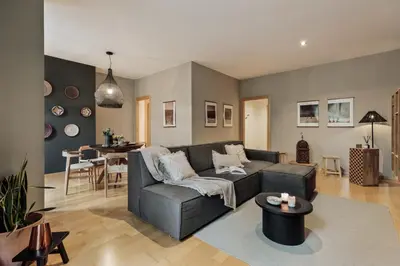 a living room with a couch and a table at Etosha - 3 bedrooms and balcony in Eixample Dreta in Barcelona