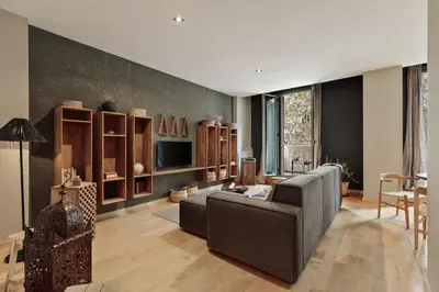 a bedroom with a bed and a wall covered in wallpaper at Etosha - 3 bedrooms and balcony in Eixample Dreta in Barcelona