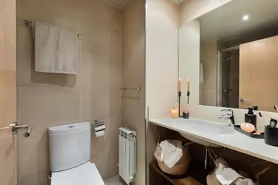 a bathroom with a sink and a bath tub at Etosha - 3 bedrooms and balcony in Eixample Dreta in Barcelona