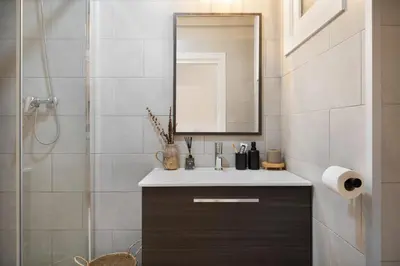 a bedroom with a bed and a large painting on the wall at Adigrat - 3 bedrooms in Gràcia in Barcelona
