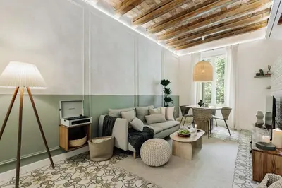 a bedroom with a large bed with a wooden tray on it at Scala - 2 bedrooms in Sant Gervasi in Barcelona