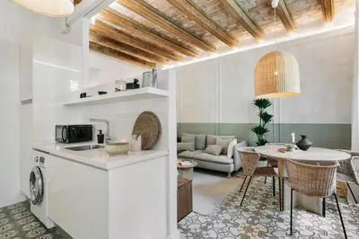 a living room with a couch and a table at Scala - 2 bedrooms in Sant Gervasi in Barcelona