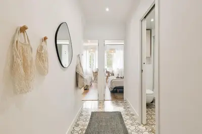a living room with a table and chairs and a couch at Scala - 2 bedrooms in Sant Gervasi in Barcelona