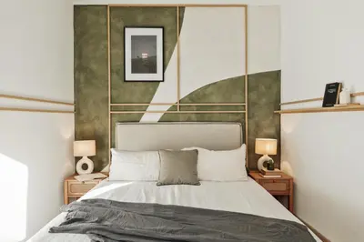 a living room with a couch and a bed at Demir - 2 bedrooms and office in Vila de Gràcia in Barcelona