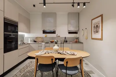 a room with windows with a chair and a desk at Aksaray - 2 bedrooms in Eixample Esquerra in Barcelona