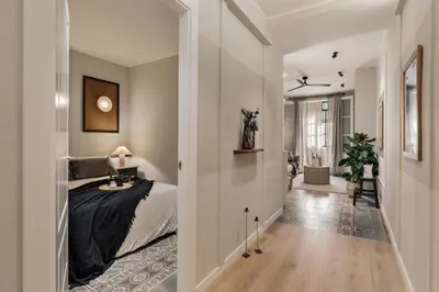 a bedroom with a bed with a table on it at Aksaray - 2 bedrooms in Eixample Esquerra in Barcelona