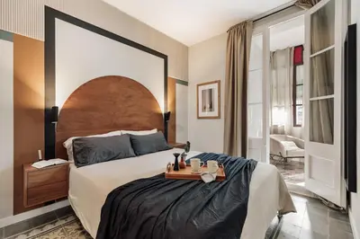 a living room with a couch and a tv at Aksaray - 2 bedrooms in Eixample Esquerra in Barcelona