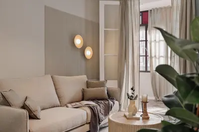 a bathroom with a sink and a toilet and a mirror at Aksaray - 2 bedrooms in Eixample Esquerra in Barcelona