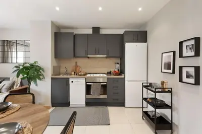 a living room with a table and chairs at Ceret - 1 bedroom in Gòtic in Barcelona