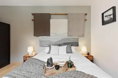 a living room with a table and a kitchen at Ceret - 1 bedroom in Gòtic in Barcelona