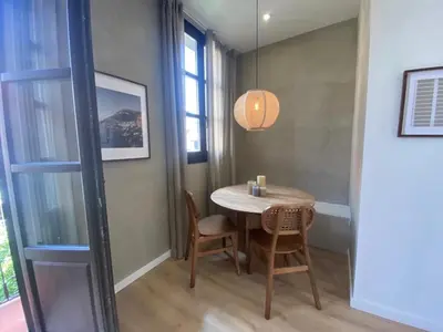a small dining room with a table and chairs at Tramonti - 2 bedrooms and terrace in Sant Antoni in Barcelona