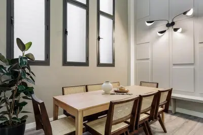a bedroom with a large bed and a lamp at Marce - 3 bedrooms and a terrace in Les Corts in Barcelona