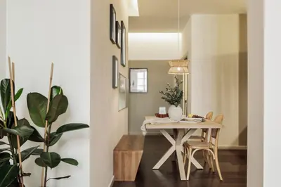 a living room with a tv on a wall at Ilani - 2 bedrooms in El Gòtic in Barcelona
