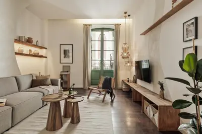 a bedroom with a large bed and a mirror at Ilani - 2 bedrooms in El Gòtic in Barcelona