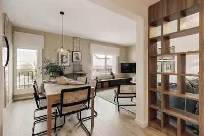 a dining room and living room with a table and chairs at Dota - 3 bedrooms in Sant Gervasi - Galvany in Barcelona