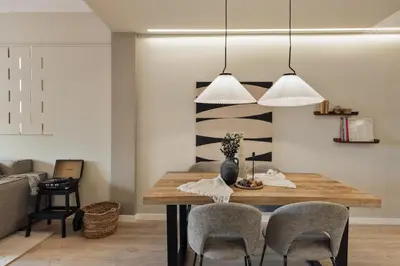 a living room with a couch and a large window at Huila - 2 bedrooms and balcony in Les Corts in Barcelona