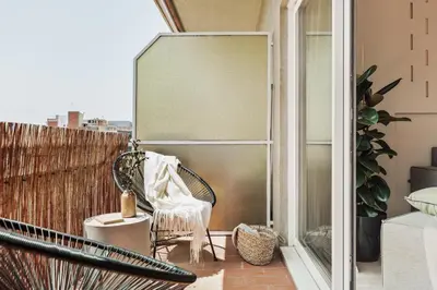 a bedroom with a bed with two cups and a table at Huila - 2 bedrooms and balcony in Les Corts in Barcelona