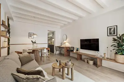 a desk with a lamp and a mirror at Belua - 2 bedrooms in Sarrià in Barcelona