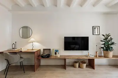 a living room with a couch and a table at Belua - 2 bedrooms in Sarrià in Barcelona