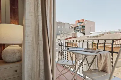 a white bathroom with a sink and a toilet at Alaju - 3 bedrooms and balcony in Les Corts in Barcelona