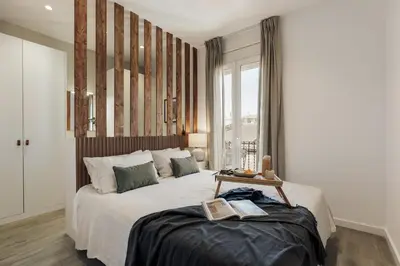 a living room with a couch and two tables at Alaju - 3 bedrooms and balcony in Les Corts in Barcelona