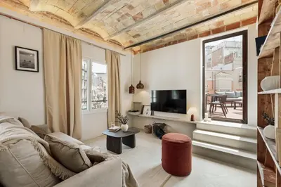 a bedroom with a large bed and a window at Gandoc - 3 bedrooms and terrace in Sants in Barcelona