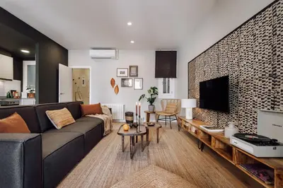 a bedroom with a bed with a plant and a lamp at Feshi - 3 bedrooms in Eixample Dreta in Barcelona
