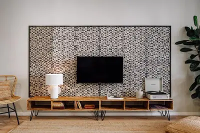 a living room with a couch and a tv at Feshi - 3 bedrooms in Eixample Dreta in Barcelona