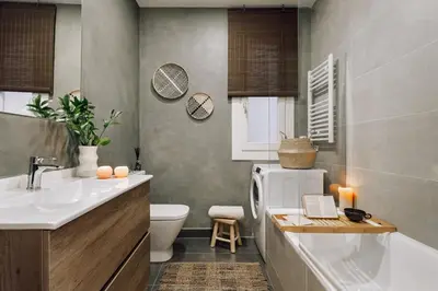 an office with a desk with a chair and a plant at Feshi - 3 bedrooms in Eixample Dreta in Barcelona