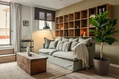 a bedroom with a bed and a desk and a window at Remy - 2 bedrooms and terrace in Eixample Dreta in Barcelona
