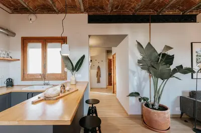 a bathroom with a washing machine and a sink at Rio Doce - 1 bedroom and terrace in Gòtic in Barcelona