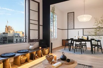 a bedroom with a large bed in a room with a window at Haku - 3 bedrooms in Eixample Dreta in Barcelona