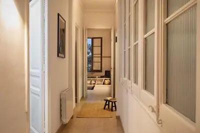 a dining room with a black table and chairs at Haku - 3 bedrooms in Eixample Dreta in Barcelona