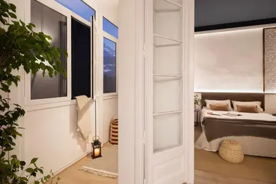 a mirror hanging on a wall with wooden bats at Haku - 3 bedrooms in Eixample Dreta in Barcelona