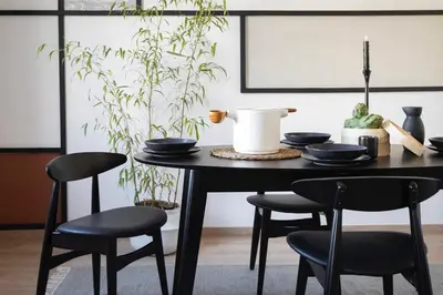 a dining room with a table and a large window at Haku - 3 bedrooms in Eixample Dreta in Barcelona