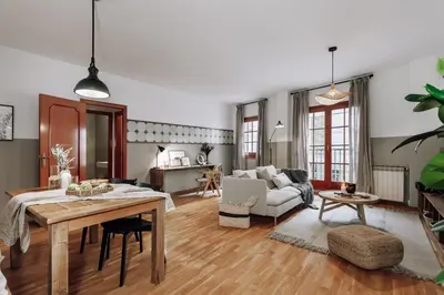 a living room with a table and a couch at Cortijo - 2 bedrooms in Gràcia in Barcelona