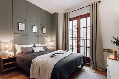 a dining room and living room with a table at Cortijo - 2 bedrooms in Gràcia in Barcelona