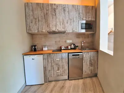 a kitchen with a white refrigerator and a microwave at DreamKeys Barcelona City in Barcelona