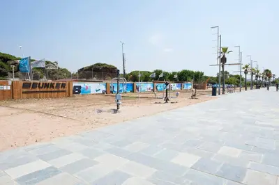 a empty street with a park with a playground at Beach vibes in Castelldefels in Castelldefels