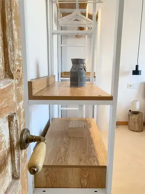 a shelf with a pot on it in a room at New penthouse duplex by the sea in Masnou