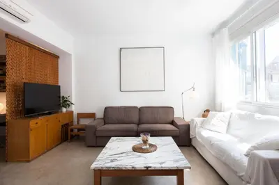 a living room with a couch and a tv at Flateli Rossello 134 in Barcelona