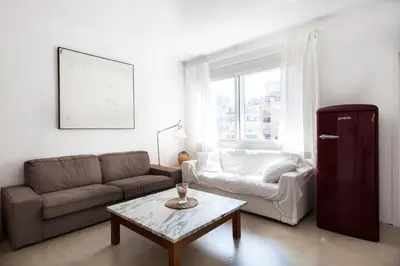 a living room with a couch and a coffee table at Flateli Rossello 134 in Barcelona