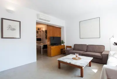 a living room with a couch and a coffee table at Flateli Rossello 134 in Barcelona