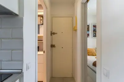 a hallway with a door leading to a bedroom at Canela Homes COSTA PALMERES in Castelldefels