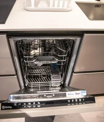 an oven with its door open in a kitchen at Sagrada família essence in Barcelona