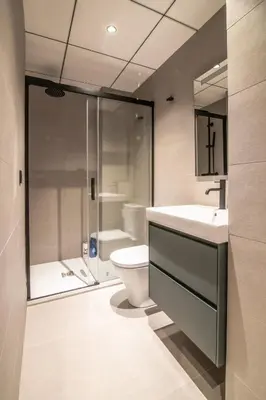 a bathroom with a toilet and a sink and a shower at Sagrada família essence in Barcelona