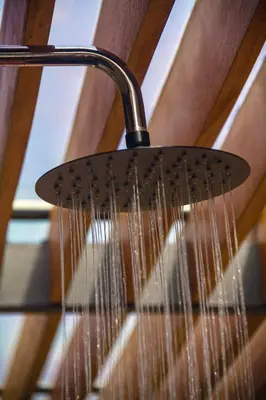 a shower head with water dripping from it at Pergola Suite - Boutique Retreat Loft Barcelona Coast Panoramic Sea View in Sant Andreu de Llavaneres