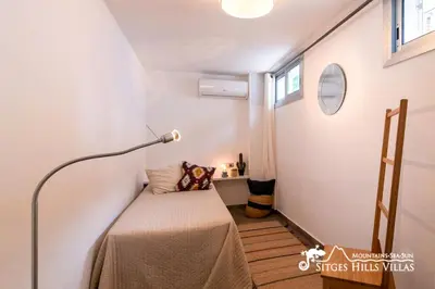 a small room with a table and a lamp at Cool & Modern Villa Giovanna with Air Conditioning, Private Pool & Sea Views in Sitges